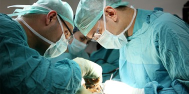 Surgeons performing a bowel cancer operation
