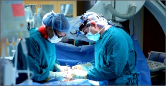 Surgeons performing surgery for piles